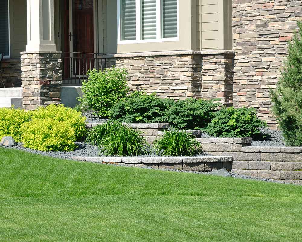 front yard with concrete retaining wall ransom canyon tx