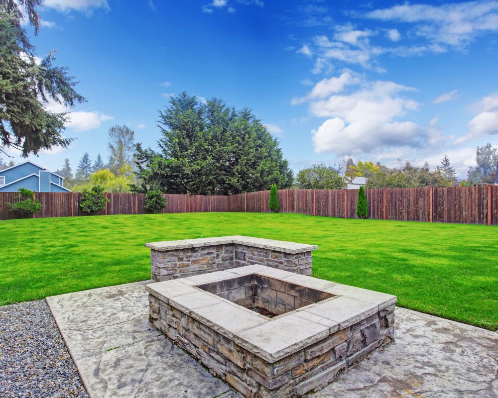 house backyard with concrete firepit installed lubbock tx